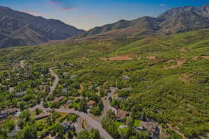 Aerial perspective of suburban area featuring a mountainous background
