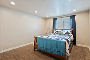 Bedroom featuring carpet and recessed lighting
