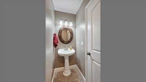 Bathroom with baseboards and a sink