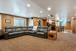 Living room featuring recessed lighting and light colored carpet