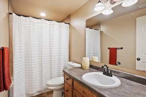 Full bathroom with vanity and shower / bath combination with curtain