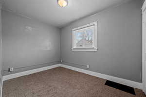 Spare room with carpet floors and a textured ceiling