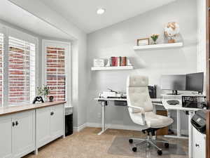 Office space featuring light carpet and recessed lighting