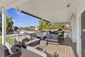 Trek deck featuring an outdoor hangout area, a residential view, and a swimming pool