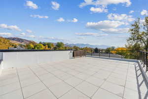 View of patio / terrace with a mountain view