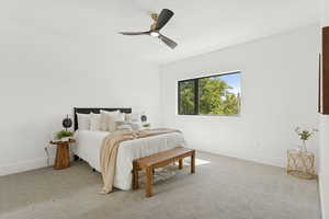 Bedroom featuring light carpet and ceiling fan