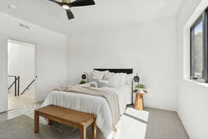 Bedroom featuring ceiling fan and light colored carpet