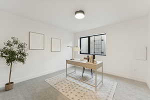 Office space featuring light colored carpet
