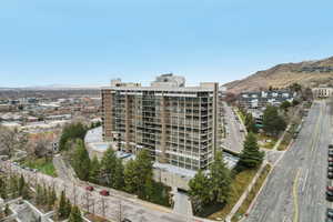 View of apartment building / complex with a mountain view and a view of city