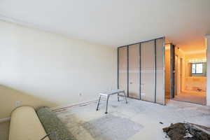 Unfurnished bedroom with ornamental molding and a closet