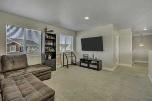 Living room featuring light colored carpet
