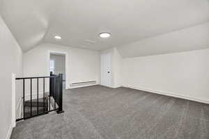 Bonus room with carpet floors and baseboard heating