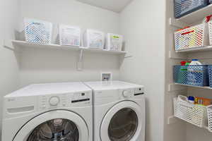 Laundry room featuring washing machine and dryer