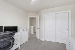 Office featuring light colored carpet and baseboards