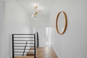 Stairway with baseboards and wood finished floors