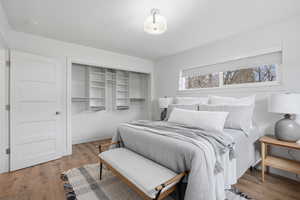Upstairs Bedroom with light wood-style floors and a closet