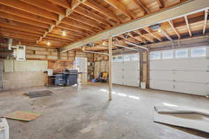 Garage with concrete block wall and a garage door opener