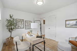 Upstairs Office space featuring wood finished floors