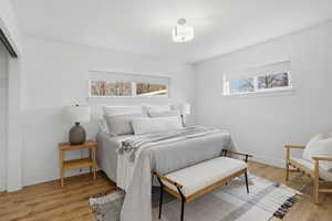 Upstairs Bedroom featuring light wood-style flooring and a closet