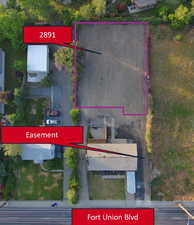 Aerial view of property and surrounding area with property boundaries highlighted