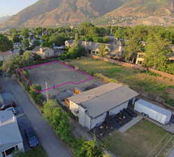 Aerial view of property and surrounding area with property boundaries highlighted.