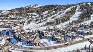 Snowy aerial view featuring a mountain view