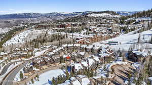 Snowy aerial view featuring a mountain view