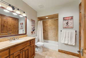 Full bathroom featuring vanity and shower / bath combo