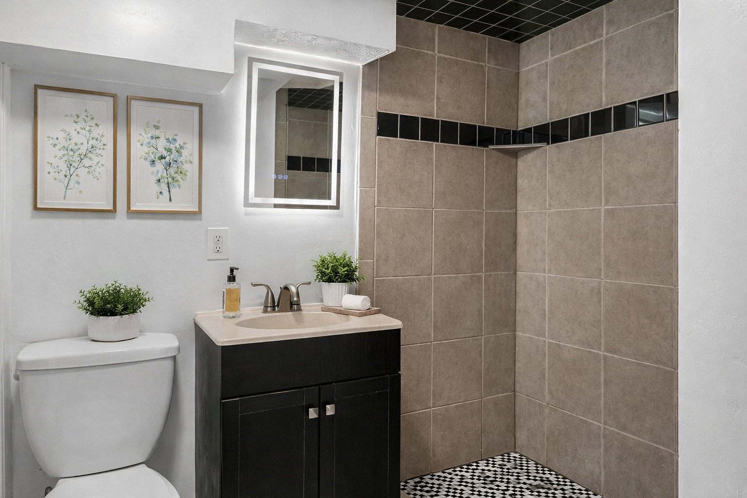 Full bath with vanity and a shower