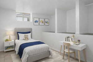 Bedroom featuring a textured ceiling and light tile patterned flooring