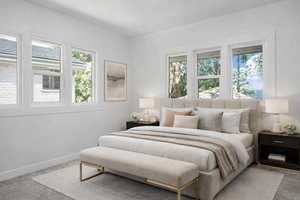 Carpeted bedroom with baseboards