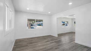 Wood-style floors, recessed lighting, and plenty of natural light