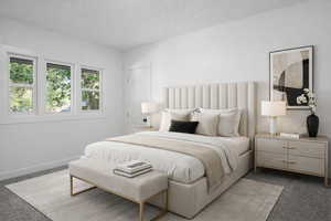 Carpeted bedroom with a textured ceiling