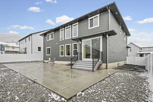 Back of property with a patio area, a fenced backyard, entry steps, and a mountain view