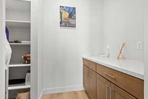 Butlers pantry featuring a countertop and storage shelves.