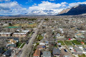 Aerial perspective of suburban area featuring a mountain backdrop