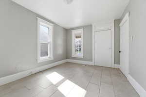 Bedroom with baseboards and a closet
