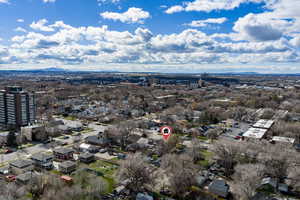 Aerial perspective of suburban area with a mountainous background