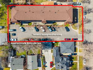 Aerial view of property and surrounding area with property parcel outlined