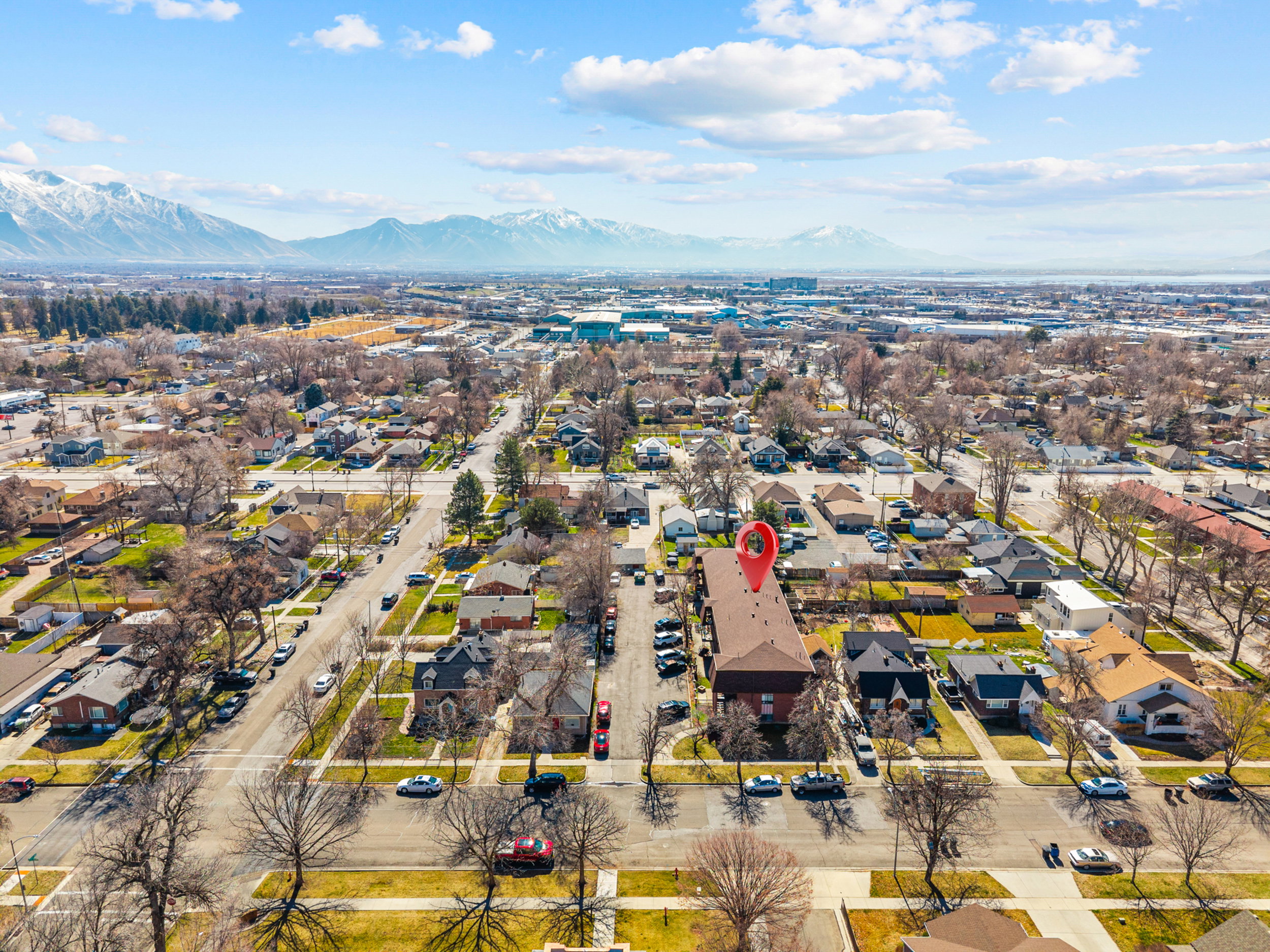 Aerial view of residential area featuring a mountain backdrop
