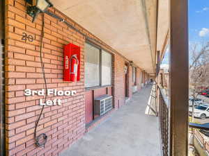 View of patio / terrace featuring a wall mounted air conditioner