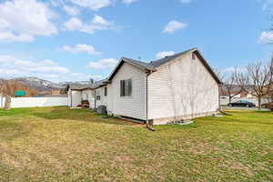 View of home's exterior featuring a mountain view and a central AC unit