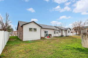 Rear view of house featuring a patio