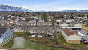 Aerial view of residential area featuring a water and mountain view