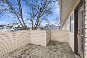 Wooden deck featuring a residential view