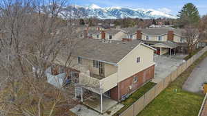 Aerial perspective of suburban area featuring a mountain backdrop