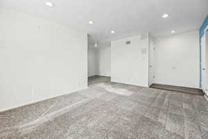 Unfurnished room with recessed lighting and carpet flooring