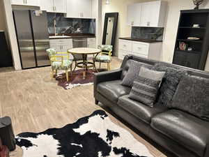 Living room with light wood-type flooring