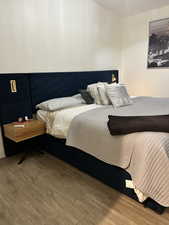 Bedroom featuring wood finished floors