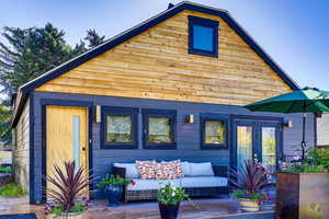 Back of house featuring a deck